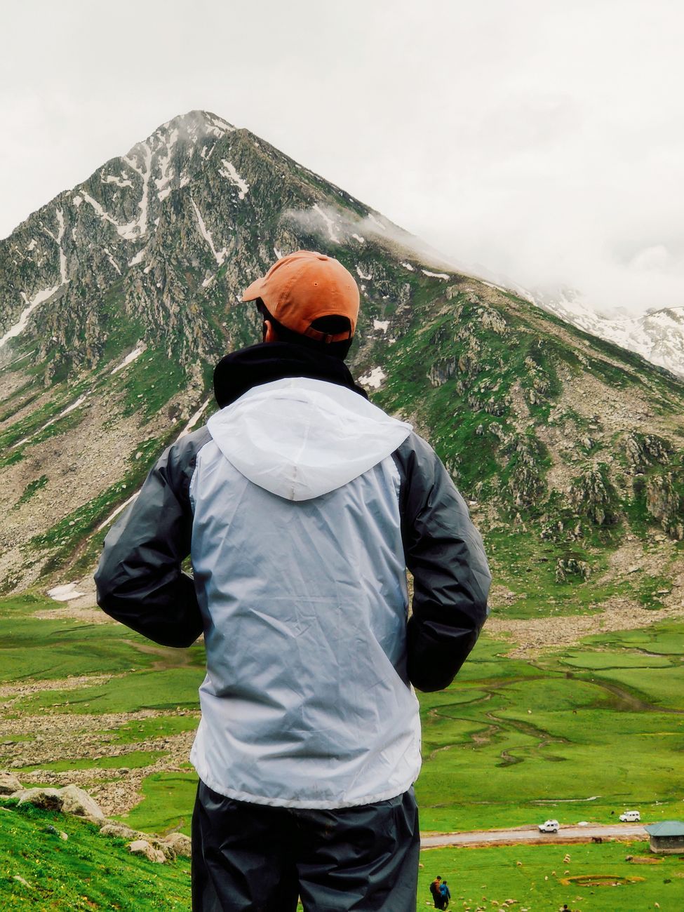 Photographer overlooking vast mountain range