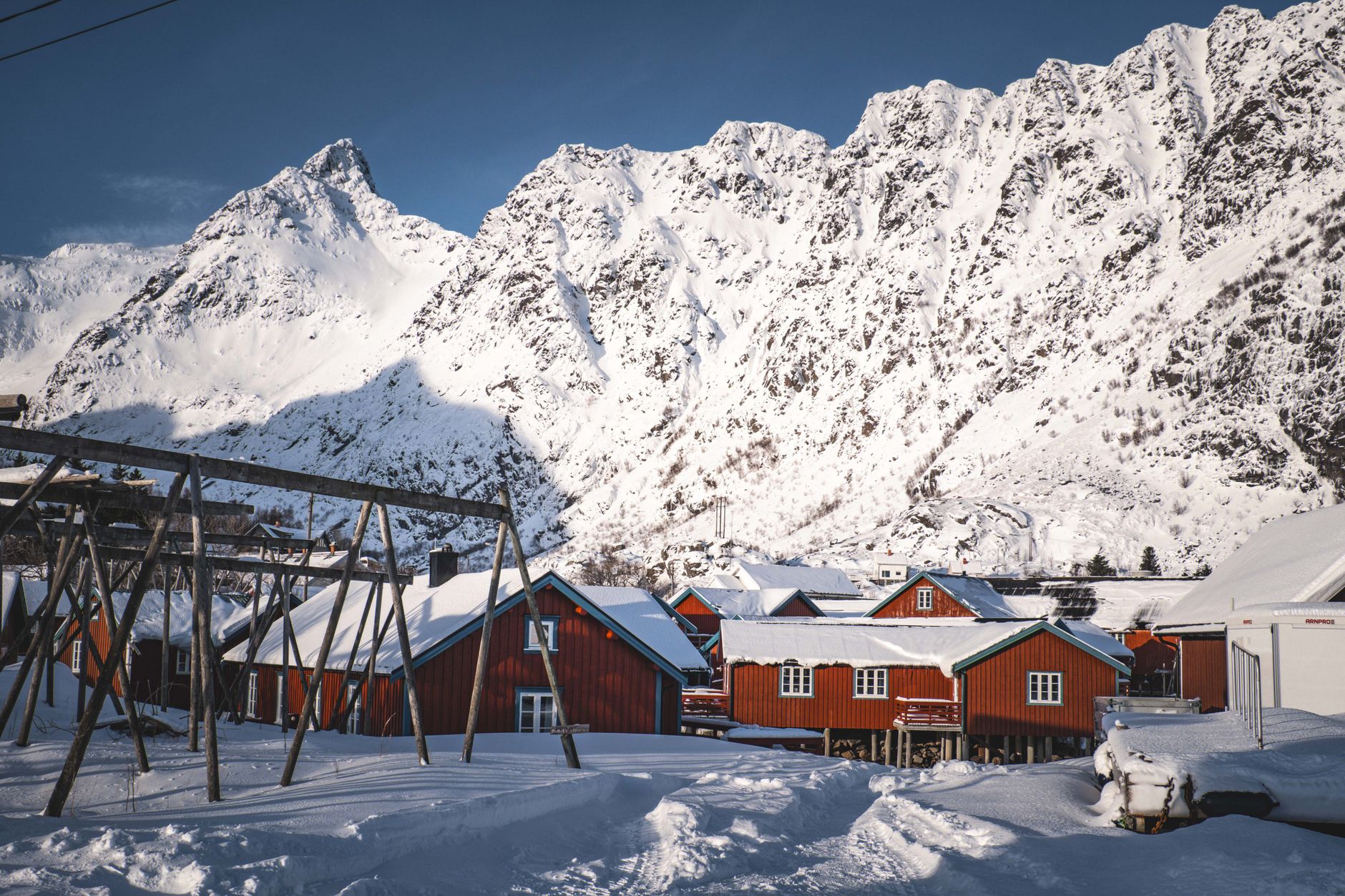 Snow-covered fjord settlement